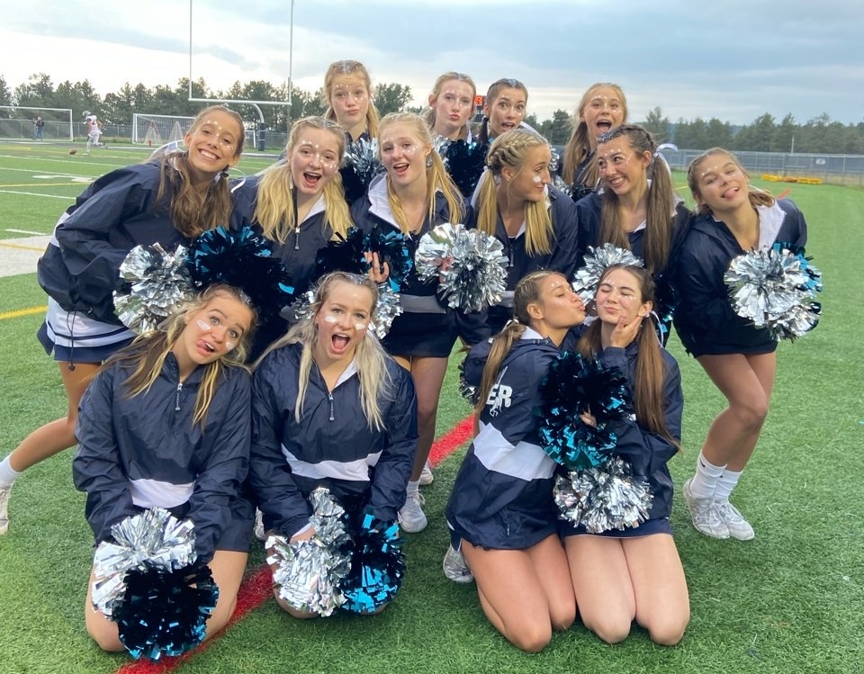 The AAHS Cheer team poses for a silly picture.